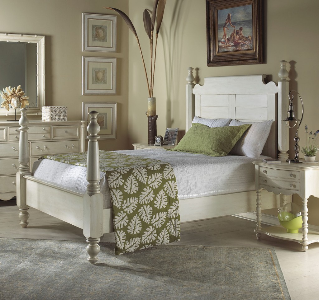 The Summer Home Collection of FFDM features this neutral colored bed and nature-inspired blanket. Notice how the blanket connects with the accent pillow, framed artworks, and the decorative piece underneath the bedside table. 